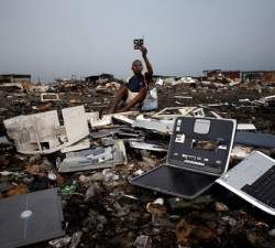 Discarded laptops lie on the ground at Agbogbloshie dump, in Accra, Ghana.
