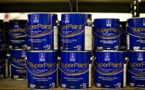 Gallon cans of Sherwin-Williams SuperPaint, a combination paint and primer, sit on a shelf for sale at a Sherwin-Williams Co. store in Princeton, Illinois, U.S., on Wednesday, July 18, 2012. The Sherwin-Williams Co. is scheduled to report second-quarter earnings on July 19. Photographer: Daniel Acker/Bloomberg via Getty Images