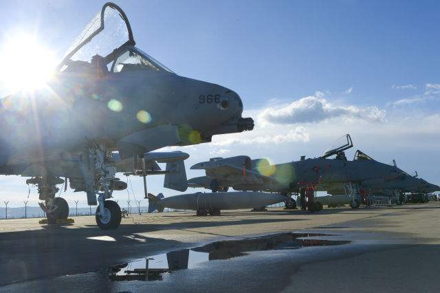 A row of U.S. Air Force A-10 Thunderbolt IIs assigned to the 354th Expeditionary Fighter Squadronare parked off the runway during a theater security package deployment at Campia Turzii, Romania, April 1, 2015. The aircraft deployed to Romania in support of Operation Atlantic Resolve to bolster air power capabilities while underscoring the U.S. commitment to European security and stability. (U.S. Air Force photo by Staff Sgt. Joe W. McFadden/Released)