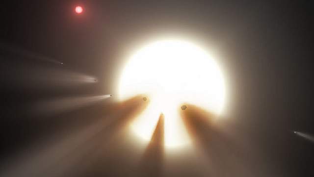 Подпись к изображению: Созданная художником иллюстрация, на которой кометное облако перекрывает свет звезды – это одно из возможных объяснений странного периодического спада яркости KIC 8462852, также известной как «Звезда Табби».